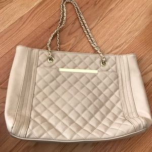 Tan bag with gold straps